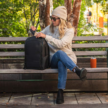 Load image into Gallery viewer, NOMATIC Backpack - woman on park bench with backpack
